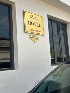 a sign for a hotel on the side of a building at New Apartment in Tashkent in Tashkent +98 photos