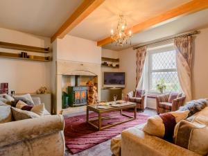 a living room with couches and a fireplace at 3 Bed in Halifax 90209 in Sowerby Bridge
