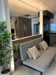 a couch with pillows on it in a kitchen at Carihuela Home in Torremolinos
