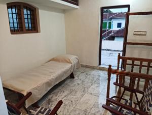 a room with a bed and a window at Shield Guest Accommodation in Pudunagaram