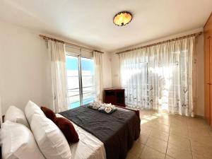 Postel nebo postele na pokoji v ubytování STAY Agapi Sea view Villa