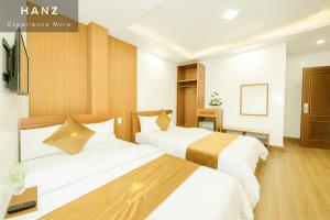 Postel nebo postele na pokoji v ubytování S79 Pho Hoa Hotel Dalat