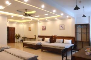 Postel nebo postele na pokoji v ubytování Ju Mông Hostel