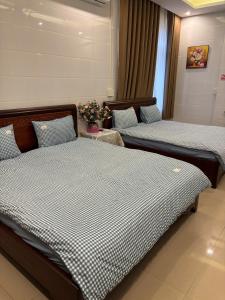 Postel nebo postele na pokoji v ubytování Ju Mông Hostel