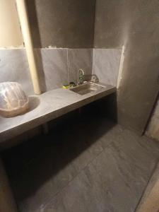 a bathroom with a sink and a counter top at Tsinoy Villa in Pandi