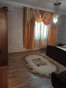 a living room with a large rug on the floor at Villa in and Home Baku in Baku