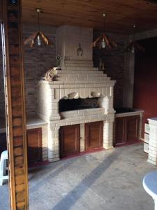 a large brick fireplace in a room with at Villa in and Home Baku in Baku