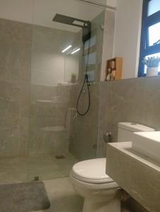 a bathroom with a toilet and a shower and a sink at 2 Bed Inside Tilisi 