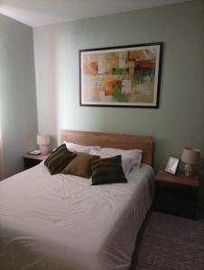 a bedroom with a large white bed with two pillows at 2 Bed Inside Tilisi 