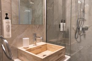 a bathroom with a sink and a shower at Pine View Boutique Hotel Adults Only in Troodos