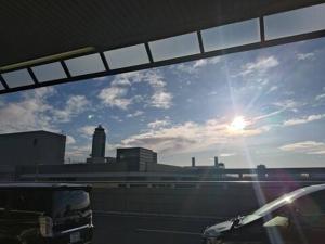 a view of the sky through a car window at Nemurupa Garden Hostel & Yoga in Narita +6 photos