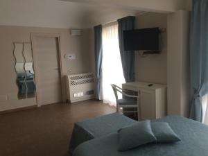A bed or beds in a room at Hotel Sant'Anna