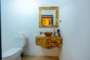 a bathroom with a mirror and a toilet at Riad des remparts Marrakech in Marrakech +88 photos