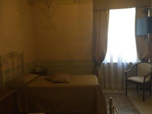 A bed or beds in a room at Hotel Sant'Anna