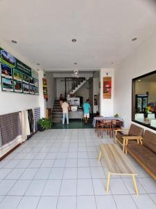 a living room with a couch and a table at KL's Coffee & Hostel in Pakse