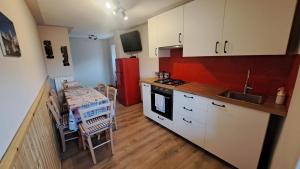 Kuchyň nebo kuchyňský kout v ubytování Appartamento Stella