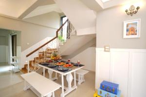 a dining room with a table with food on it at EKO STAY Gold - Gatsby Villa in Lonavala