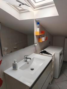 a bathroom with a sink and a mirror at Carmenhouse in Montesilvano