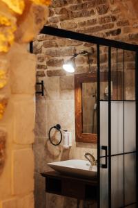 a bathroom with a sink and a mirror at Kale Konak Hotel in Mardin +43 photos