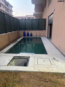 a swimming pool in the middle of a building at Elite garden in Marrakech
