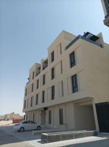 a building with a car parked in front of it at Samt Residence - LUX apartments in Quai