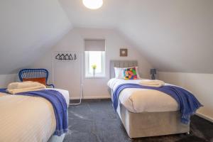 Ένα ή περισσότερα κρεβάτια σε δωμάτιο στο Corsehill Cottage - 3 Bedroom, 2 bathroom House