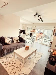 a living room with a couch and a table at APARTAMENTO PRECIOSO SOL Y SIERRA in Sierra Nevada