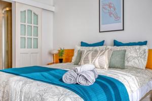 a bedroom with a bed with towels on it at Stunning Seafront Apartment with Panoramic Views in Sliema +42 photos