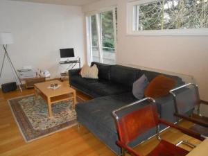 a living room with a couch and a table at Dornbirn Zentrum Bahnhof in Dornbirn