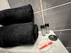 a bed with two pillows on a table in a bathroom at Superbe 4pers - Saint-mandé, 200m Paris in Saint-Mandé