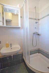 a bathroom with a sink and a shower at Apartments Marija in Cres +48 photos