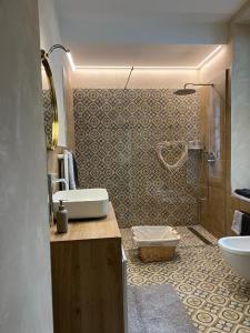 a bathroom with a sink and a toilet at FresCo b&b in Sarnico
