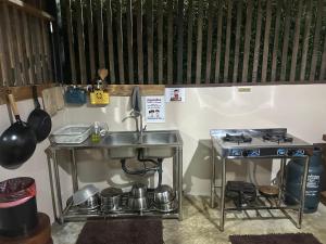 a kitchen with a sink and a stove at FourTwoEight Pai Resort in Kampong Huaibū +84 photos