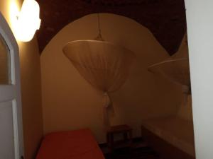 a room with two lamps and a bed and a window at جزيره سهيل in Aswan