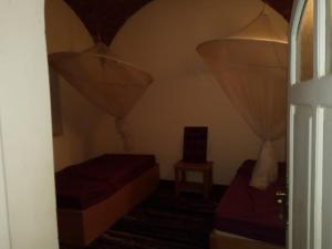 a small room with two beds and a window at جزيره سهيل in Aswan