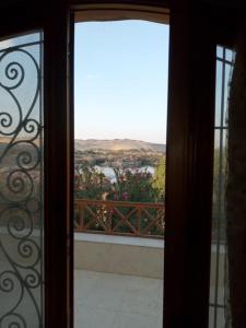 an open door with a view of a balcony at جزيره سهيل in Aswan