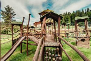 a wooden roller coaster in a park at Hotel Partizán in Tale