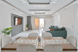 a dining room with a table and chairs at luxury house in Cairo +23 photos