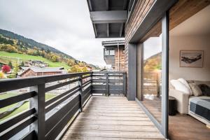 a balcony with a view of the mountains at Apartment Alva Les Gets - by EMERALD STAY in Les Gets
