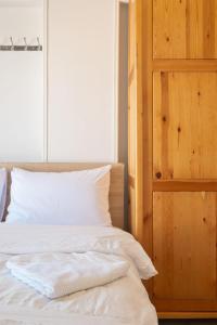 a bedroom with a bed with white sheets and a window at luxury house in Cairo