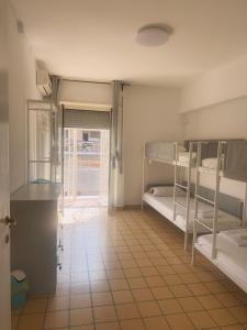 a room with two bunk beds and a window at Lisa HOUSE in Rome +34 photos