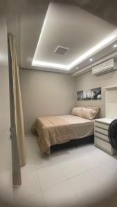 Ένα ή περισσότερα κρεβάτια σε δωμάτιο στο Comfort Jardins - Apartamento completo em frente ao Shopping Jardins