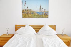 Ένα ή περισσότερα κρεβάτια σε δωμάτιο στο NB 04 - Ferienwohnung 3 Zimmer Seeblick