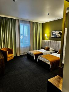 Ένα ή περισσότερα κρεβάτια σε δωμάτιο στο Гостиница БУРСА