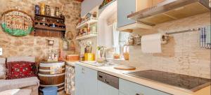a kitchen with a sink and a counter top at Kalavrita Winter Retreat - Homely Spacious Chalet in Áno Vlasía