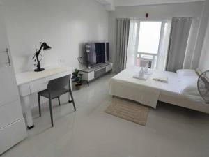 Postel nebo postele na pokoji v ubytování Studio Condo Unit- Bayani Hall Dagupan