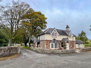 an old brick house with a stone wall at 3 Bed in Mealsgate oc-e33626 in Mealsgate