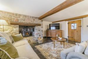a living room with a couch and a fireplace at 5 Bed in Cleeve oc-t33614 in Brockley