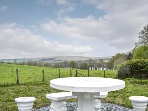 a white table sitting in the middle of a field at Spring Grove in Pooley Bridge
