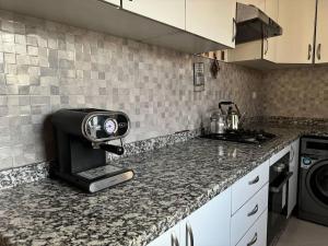 Kuchyň nebo kuchyňský kout v ubytování Appartement Centre-Ville kenitra + 13 fotografií